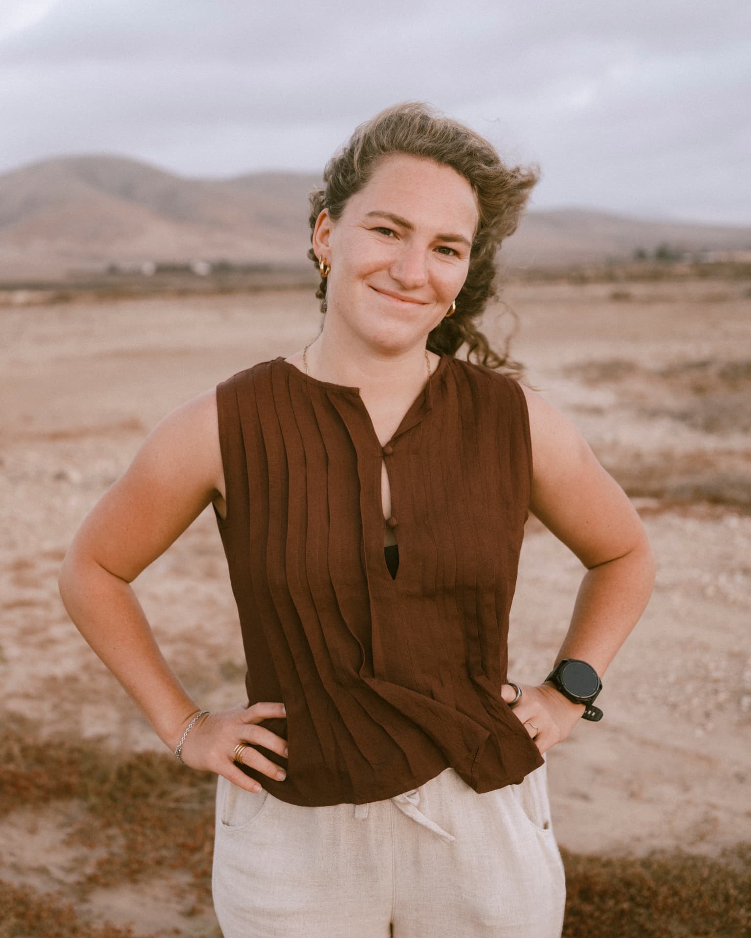 Portrait of Elena Kochler standing in a desert landscape